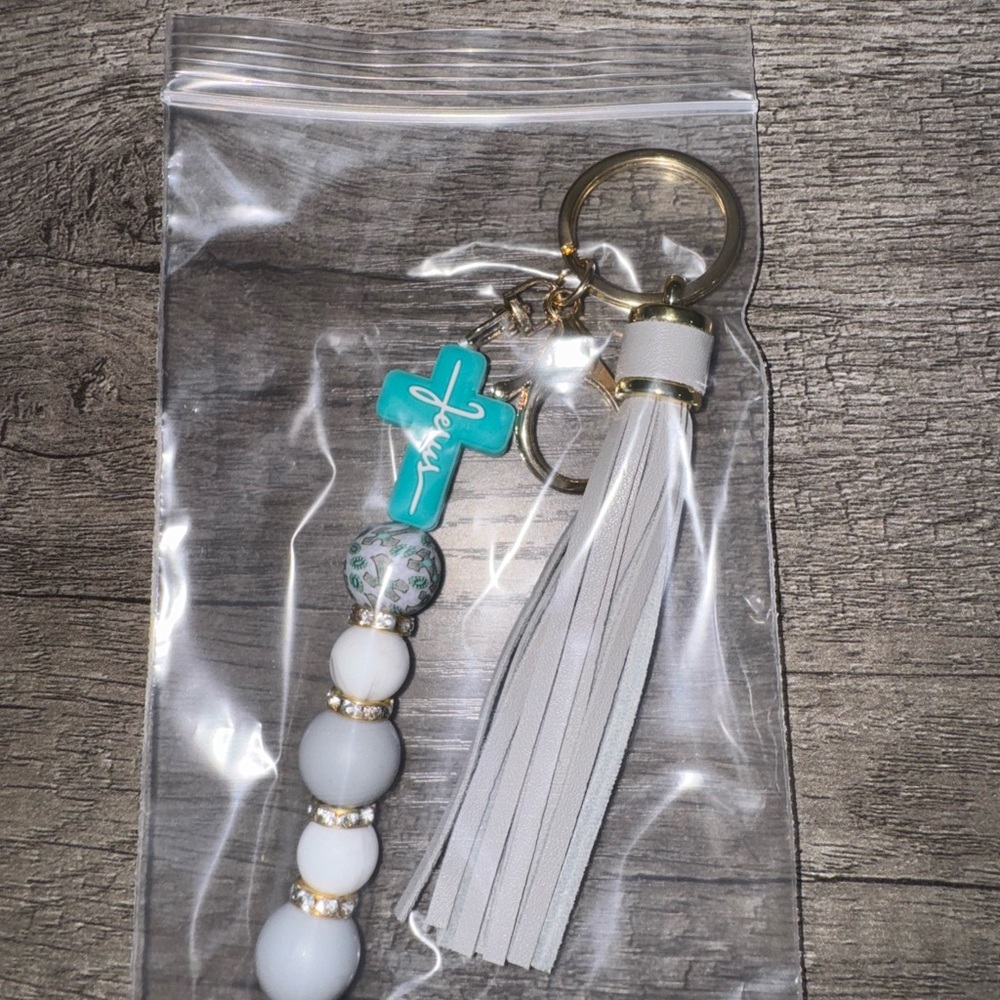 Gray and Gold Tassel Keychain with Blue Cross